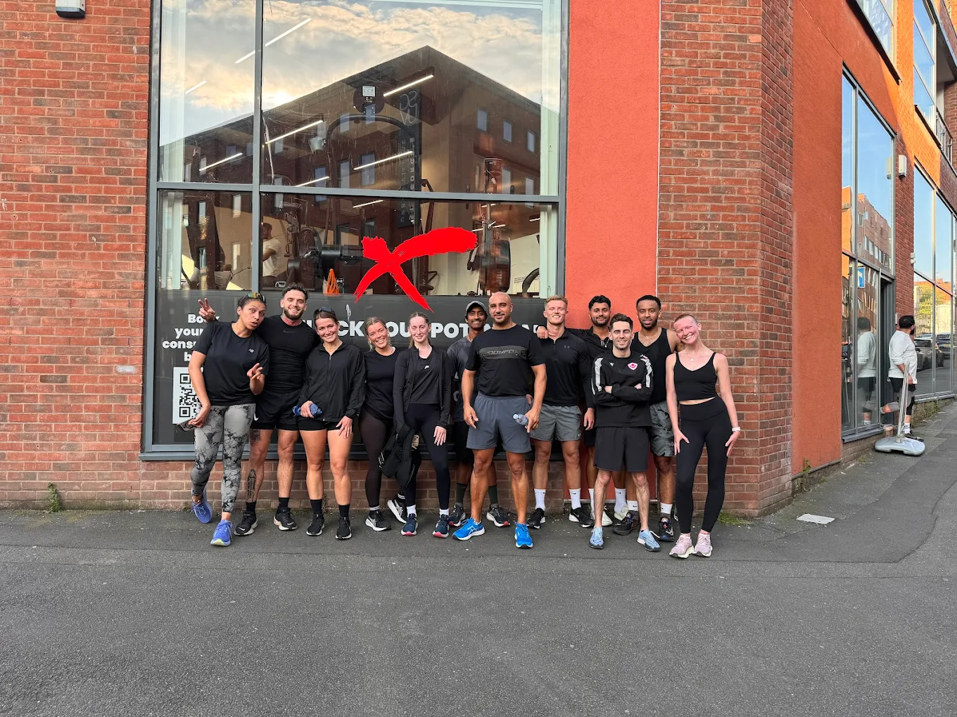KBX Run Club team photo outside the gym